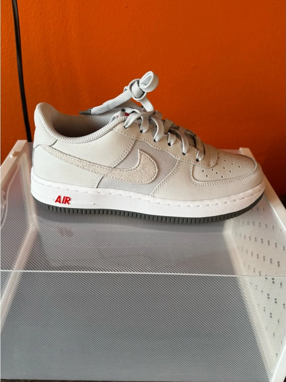 Nike Women's Air Force 1 LV8 2 Sneaker in Light Gray with Red Accent